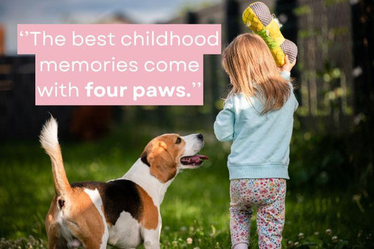 girl with her dog playing in the garden with the quote ''the best childhood memories come with four paws''