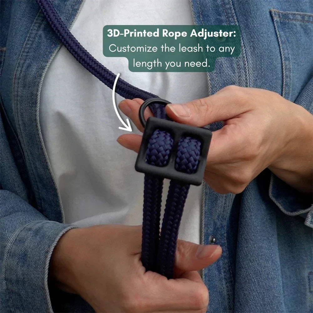 Person adjusting a navy blue dog leash with a 3D-printed rope adjuster.