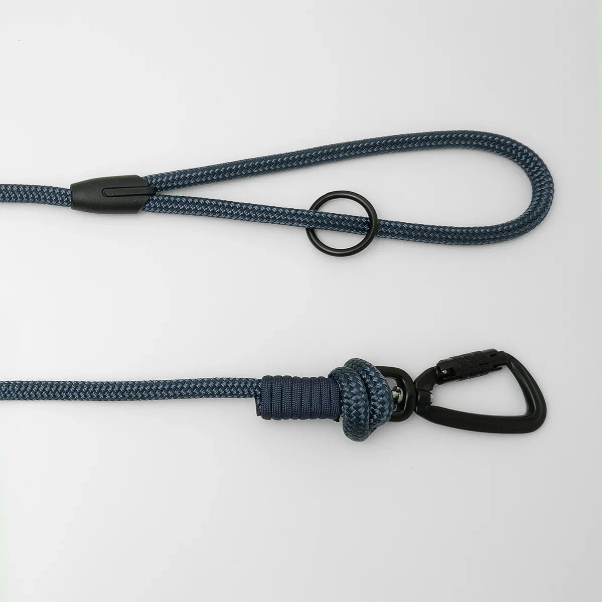 Navy blue 5m long dog leash with black carabiner and clip on a white background