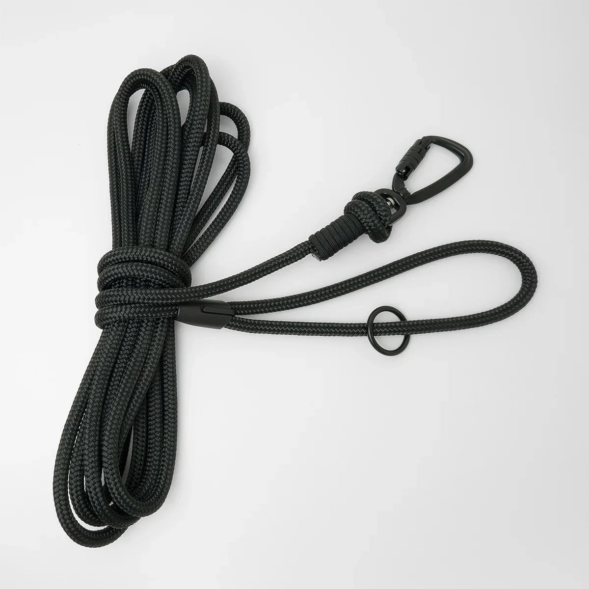 Black 5m long dog lead with a black carabiner and black O-ring on a white background
