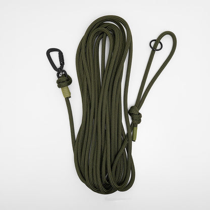 army green rope long dog lead - dog long line coiled on a white background