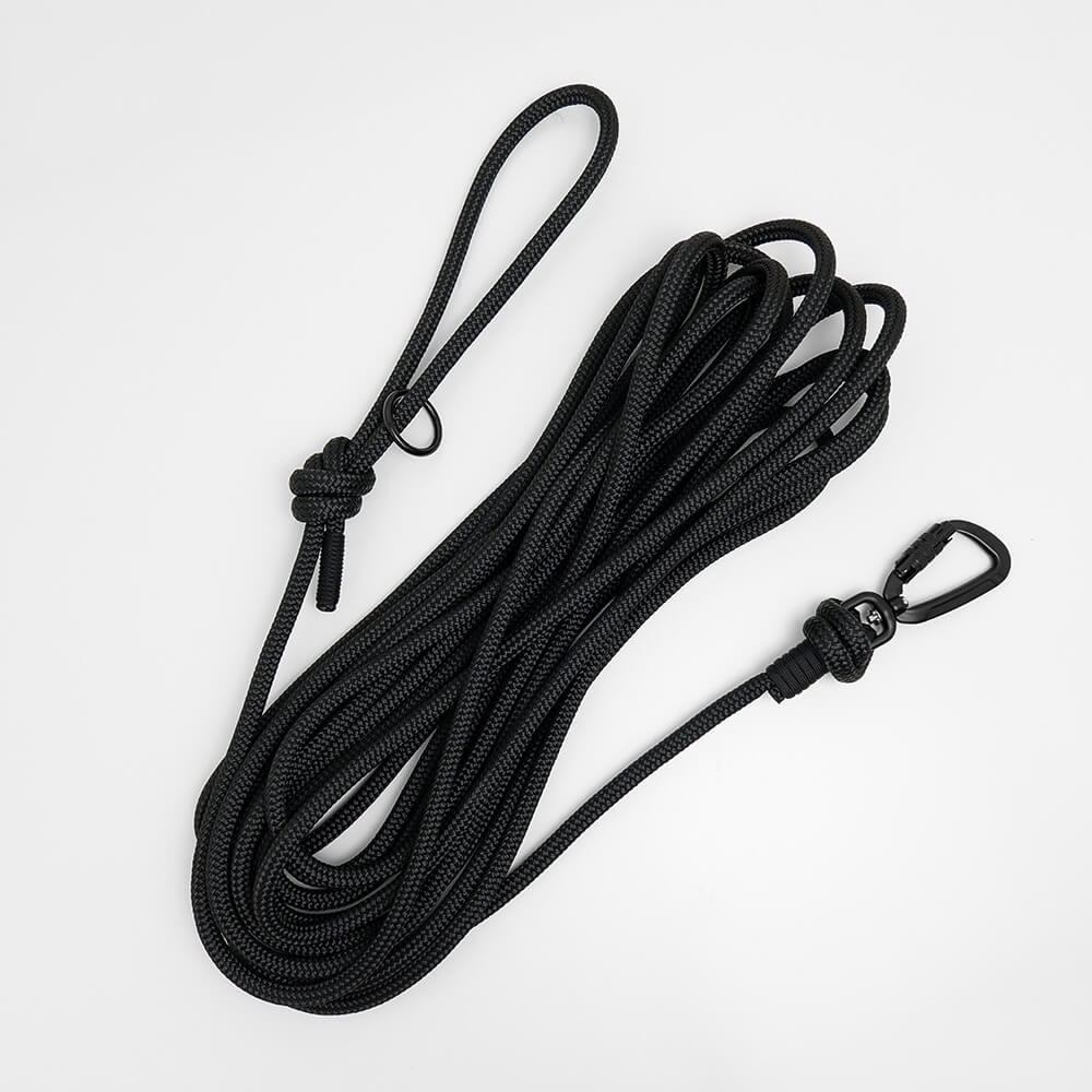black rope long dog lead on white background - long line dog lead