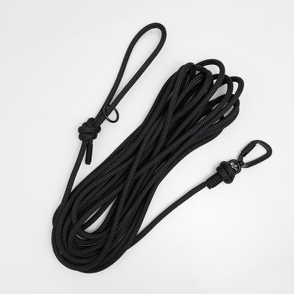 black rope long dog lead on white background - long line dog lead