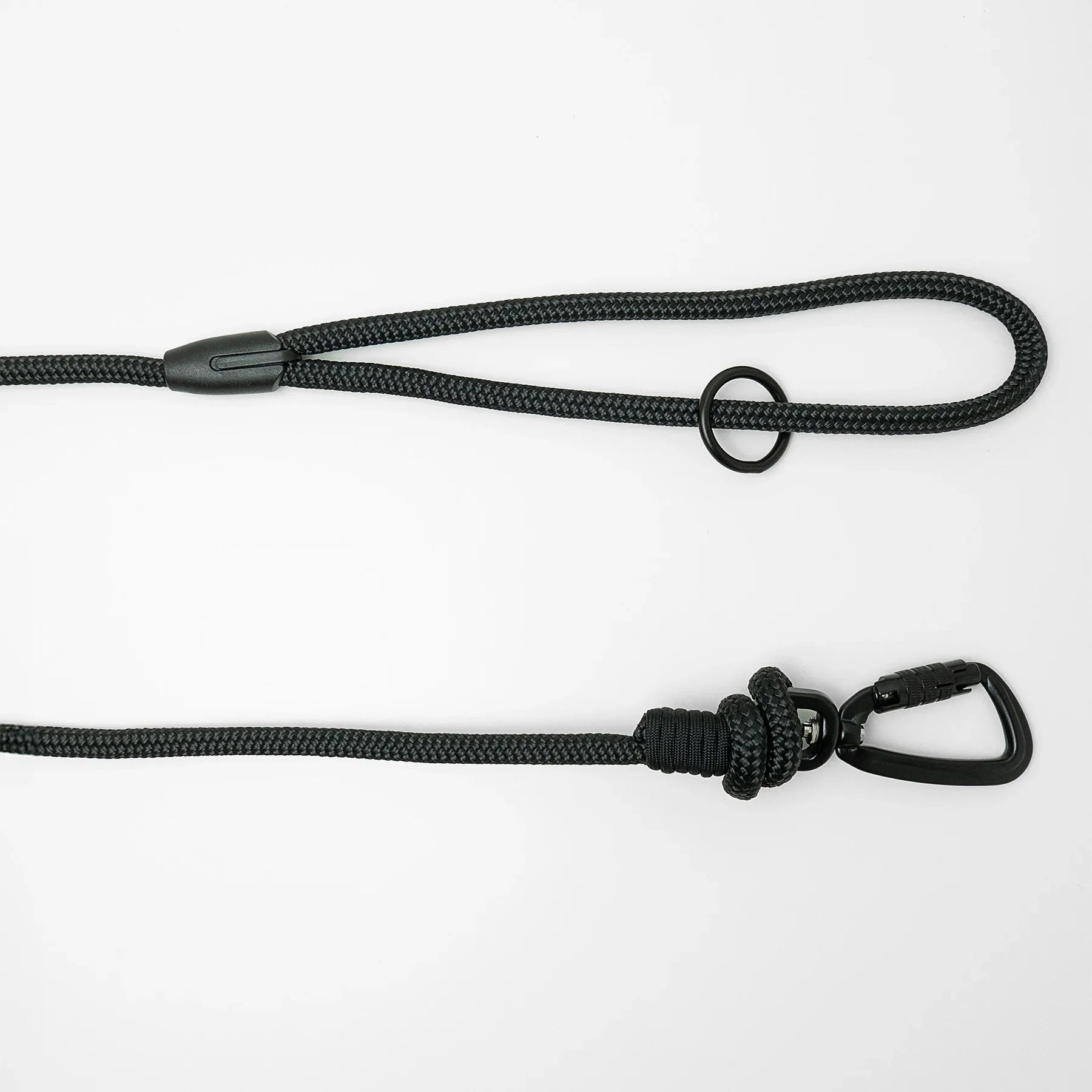 Black 5m long dog leash with black carabiner and black O-ring on a white background