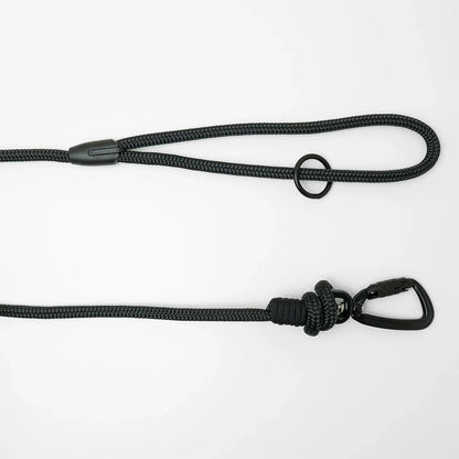 Black 5m long dog leash with black carabiner and black O-ring on a white background
