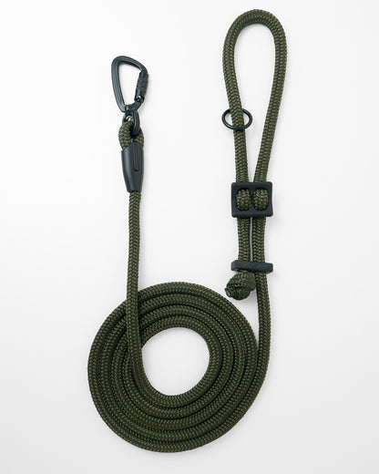 Army green hands-free dog leash by Mighty Tiga, rolled for display on white background