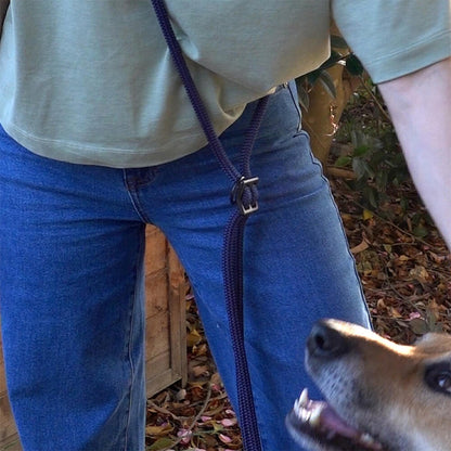person wearing hands-free dog leash over the shoulder - leash is made of rope and has 3d printed parts