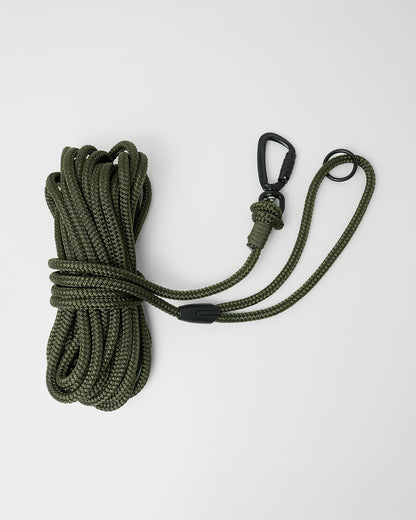 Army green long line dog training lead featuring black swivel carabiner and black O-ring, coiled on a white background