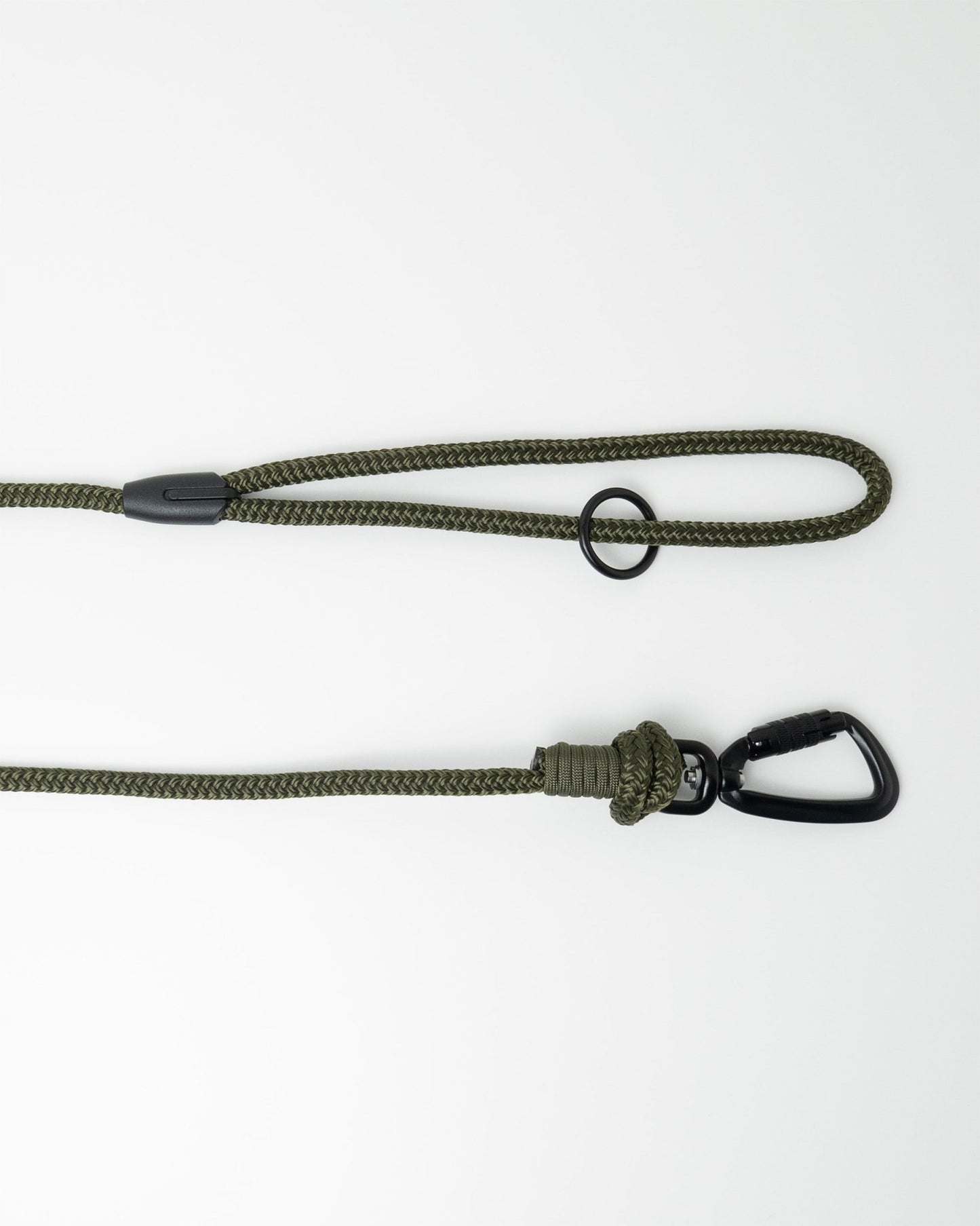 Detail view of long line dog training lead handle with black swivel carabiner and black O-ring hardware, shown in army green on white background