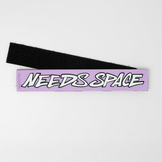 PVC dog harness patch with the text ''needs space'' on a white background