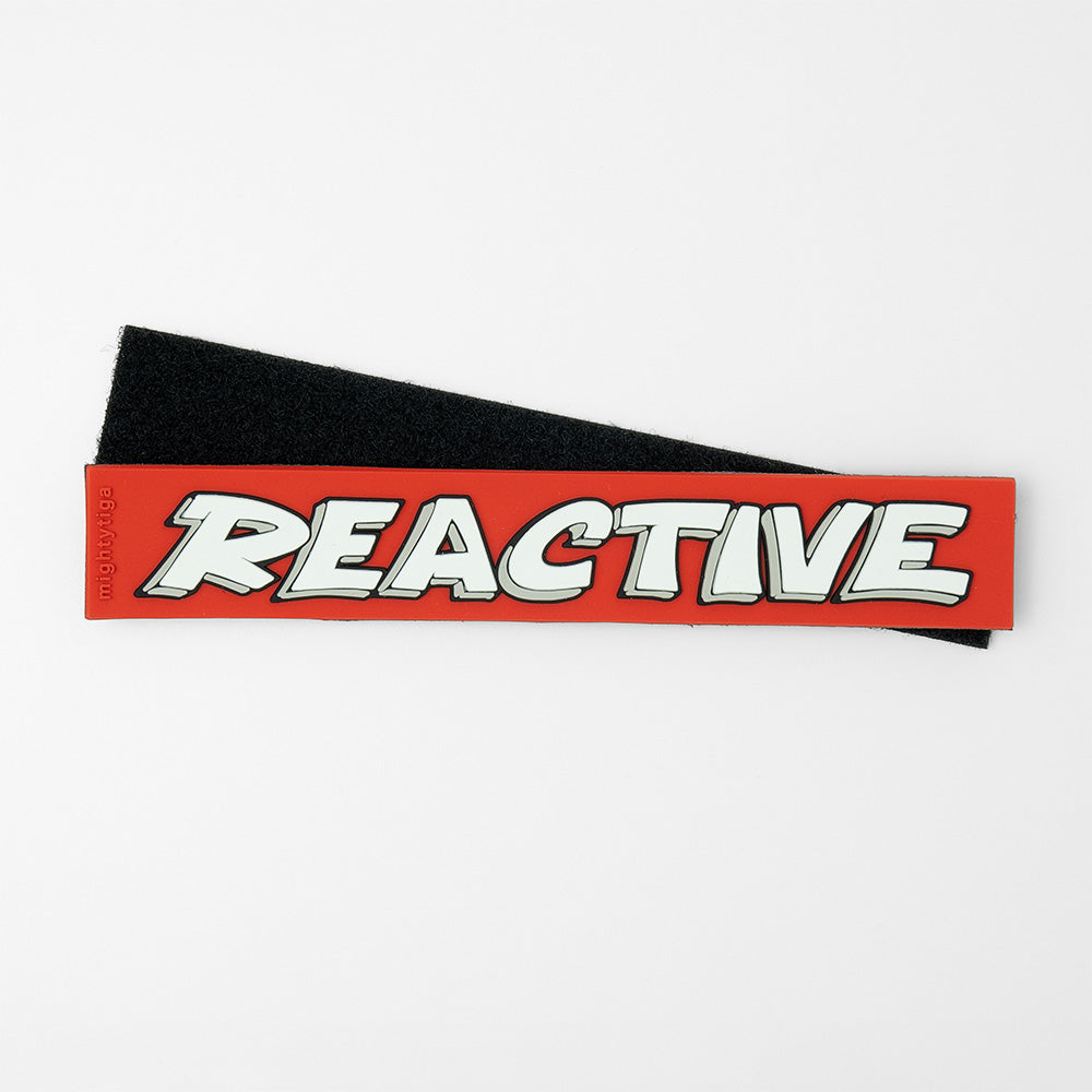 Black dog harness PVC patch with 'REACTIVE' text on a white background